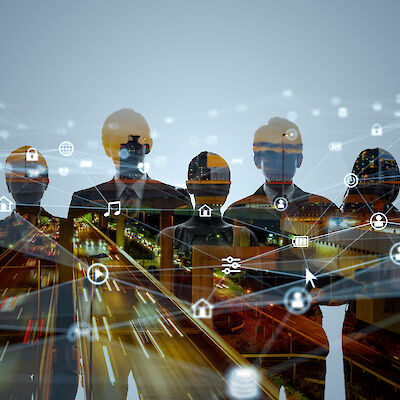 Outline of 7 people in business clothes, in the foreground the animation of a network with several nodes