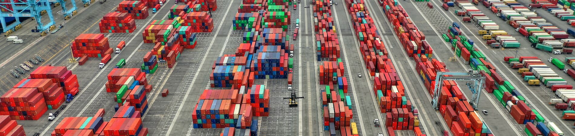 Large number of shipping containers in loading area