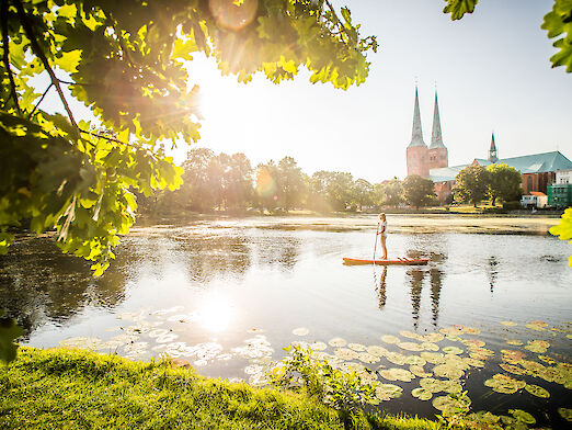 Luebeck: Stand-up paddling on Muehlenteich with cathedral