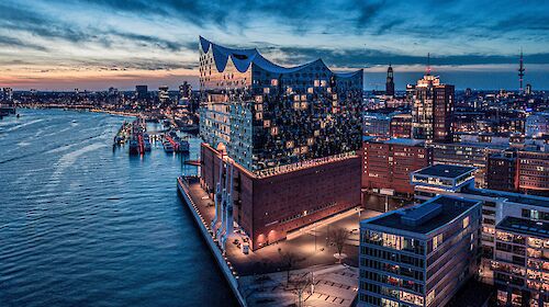 Picture of Elbphilharmonie in Hamburg with a digital network spanning the scene.