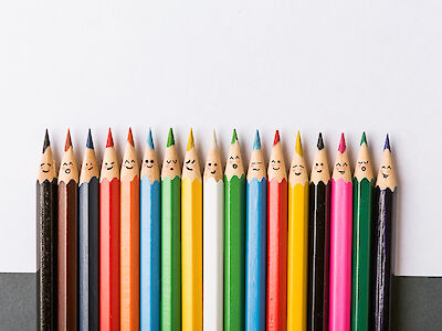 Colorful pencils with faces
